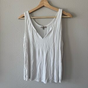 Free w/Purchase White tank top with a relaxed fit